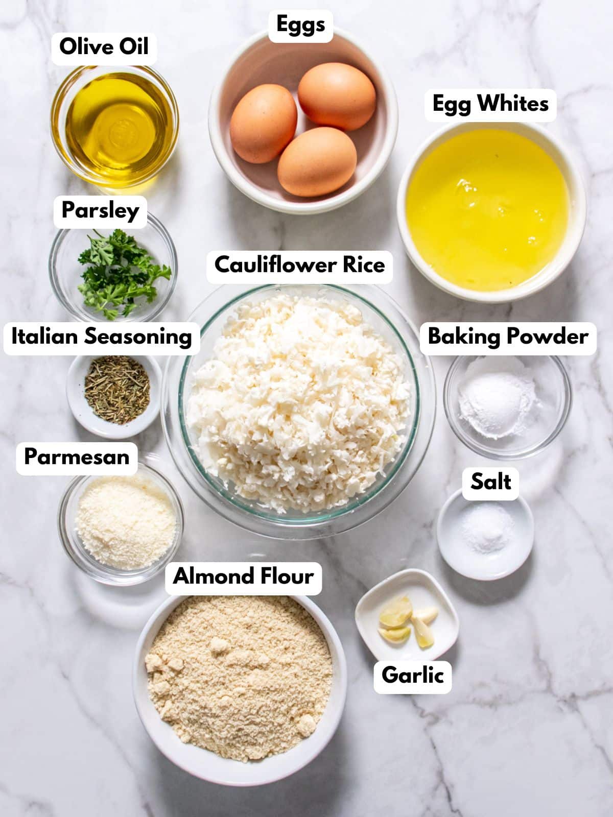 Ingredients to make cauliflower bread on a table with labels to the side. 