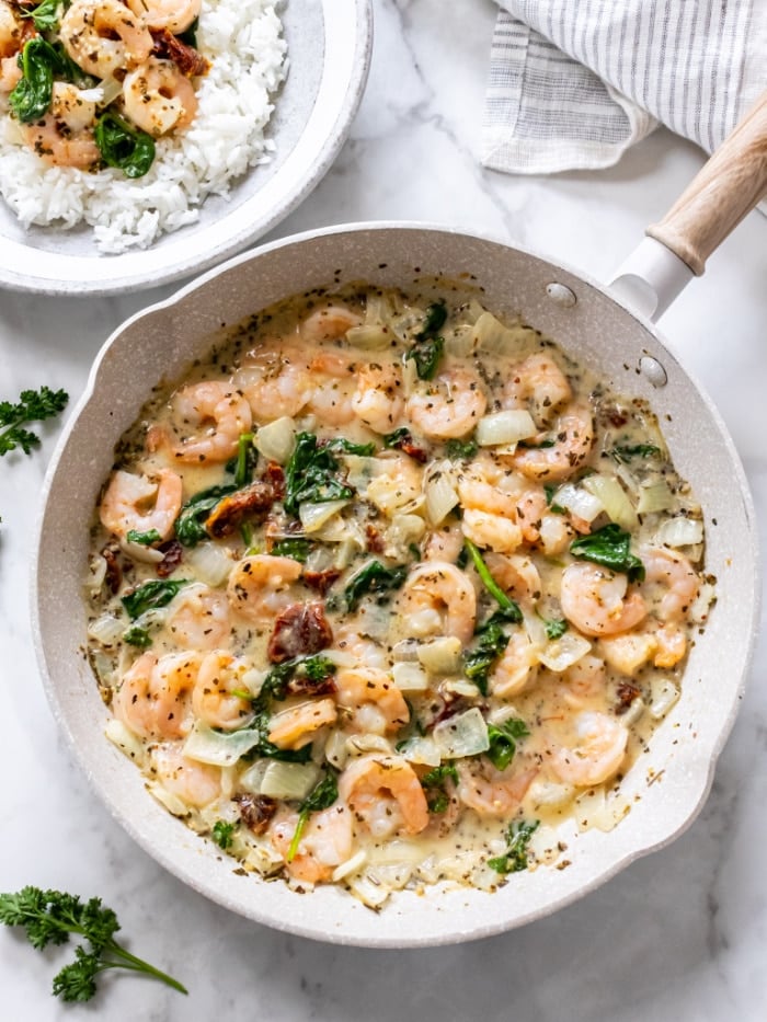 Healthy Tuscan Shrimp is made better for you with fewer calories, gluten free with healthy fat and protein for a delicious and balanced meal! Serve over rice or cauliflower rice.