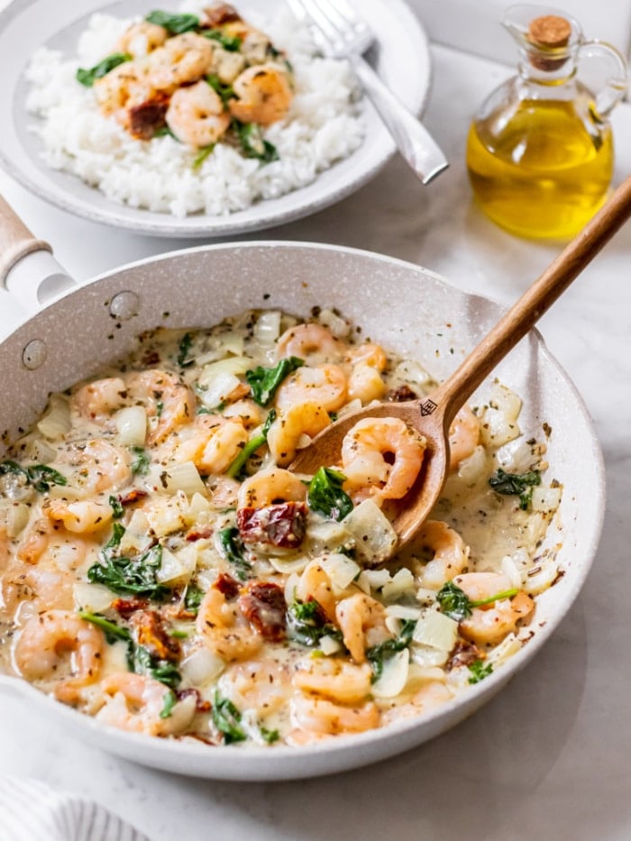 Healthy Tuscan Shrimp is made better for you with fewer calories, gluten free with healthy fat and protein for a delicious and balanced meal! Serve over rice or cauliflower rice.