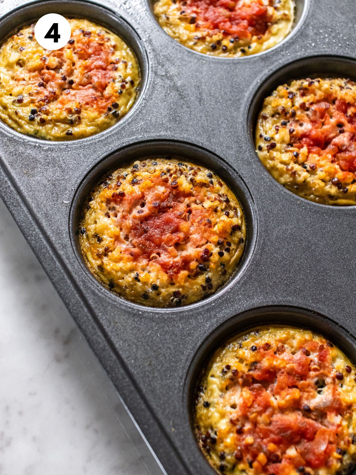 Quinoa egg bites baked and still in the muffin tin.