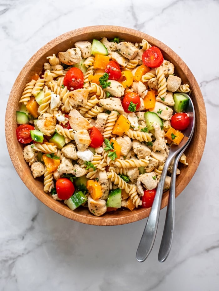 An easy Healthy Greek Chicken Pasta Salad that is perfect as a low calorie meal, appetizer or side dish. Higher protein and gluten free!