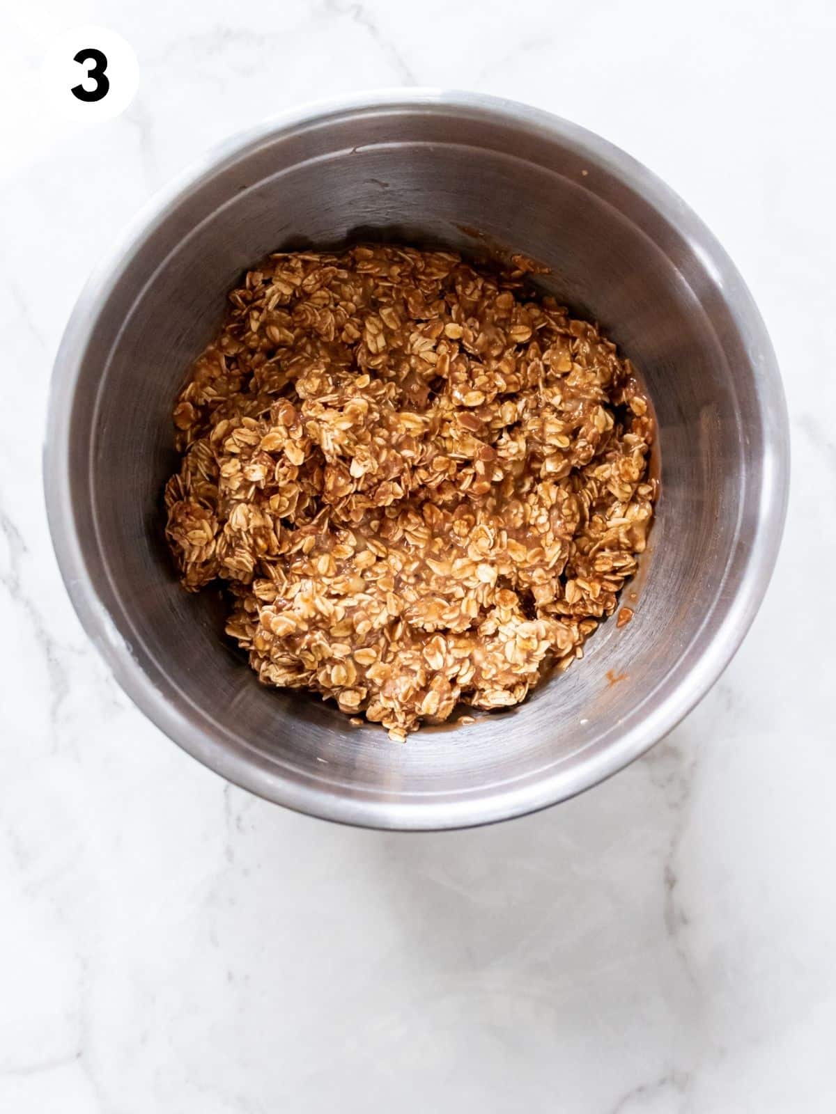 Wet and dry ingredients combined in a mixing bowl.