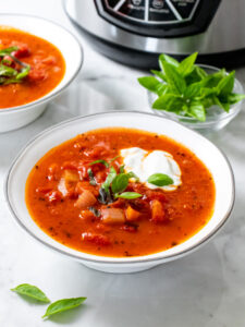 Low Calorie Tomato Soup made creamy with with a burst of protein in the instant pot or slow cooker.