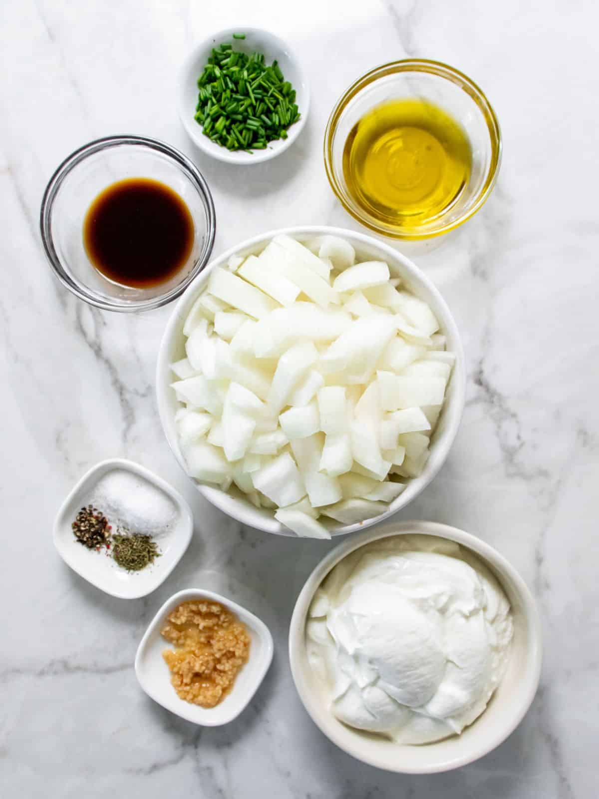 Ingredients for healthy French onion dip with yogurt on the table in bowls before preparing. 