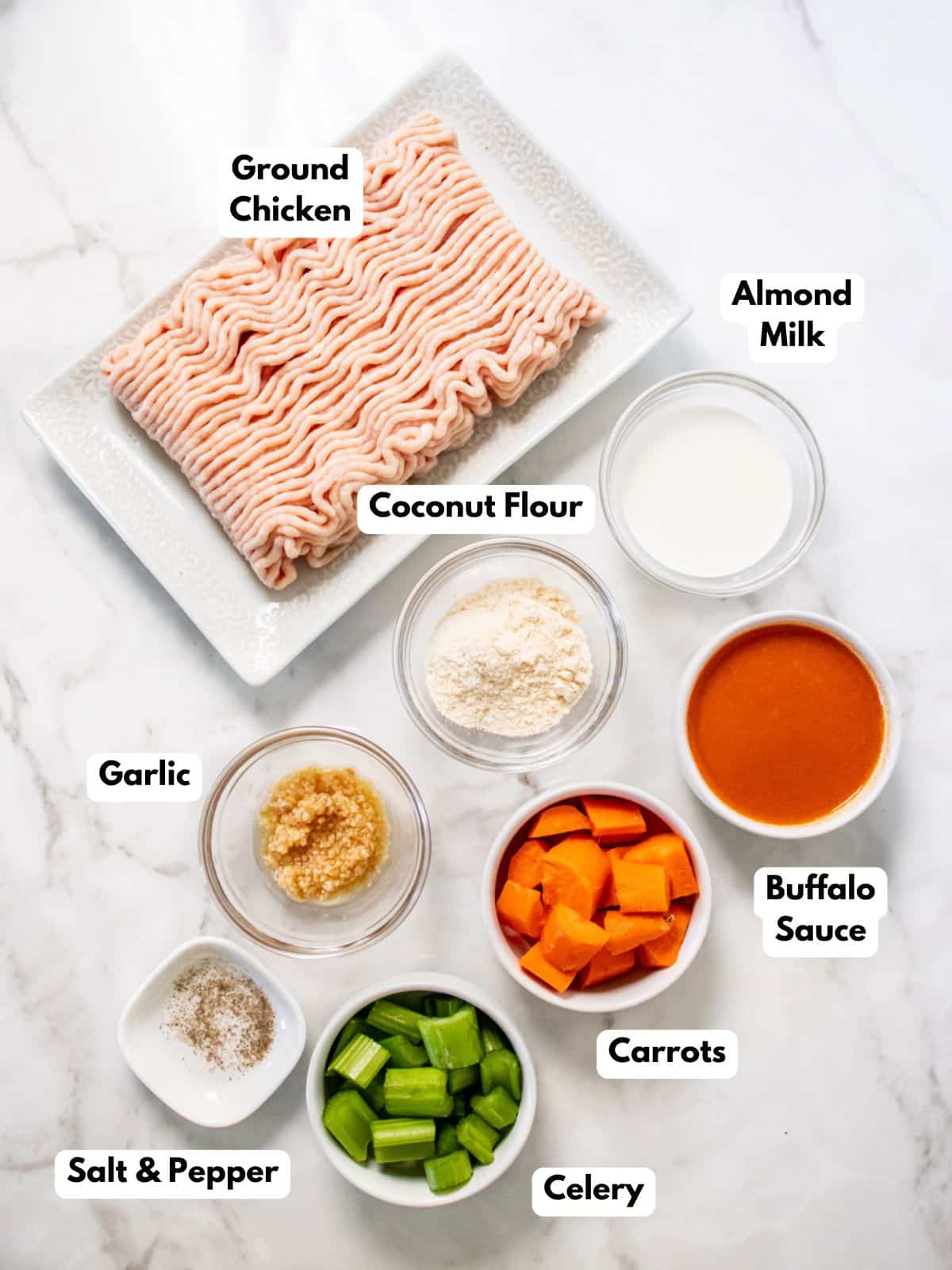 Ingredients for healthy buffalo chicken meatballs on the table before mixing.