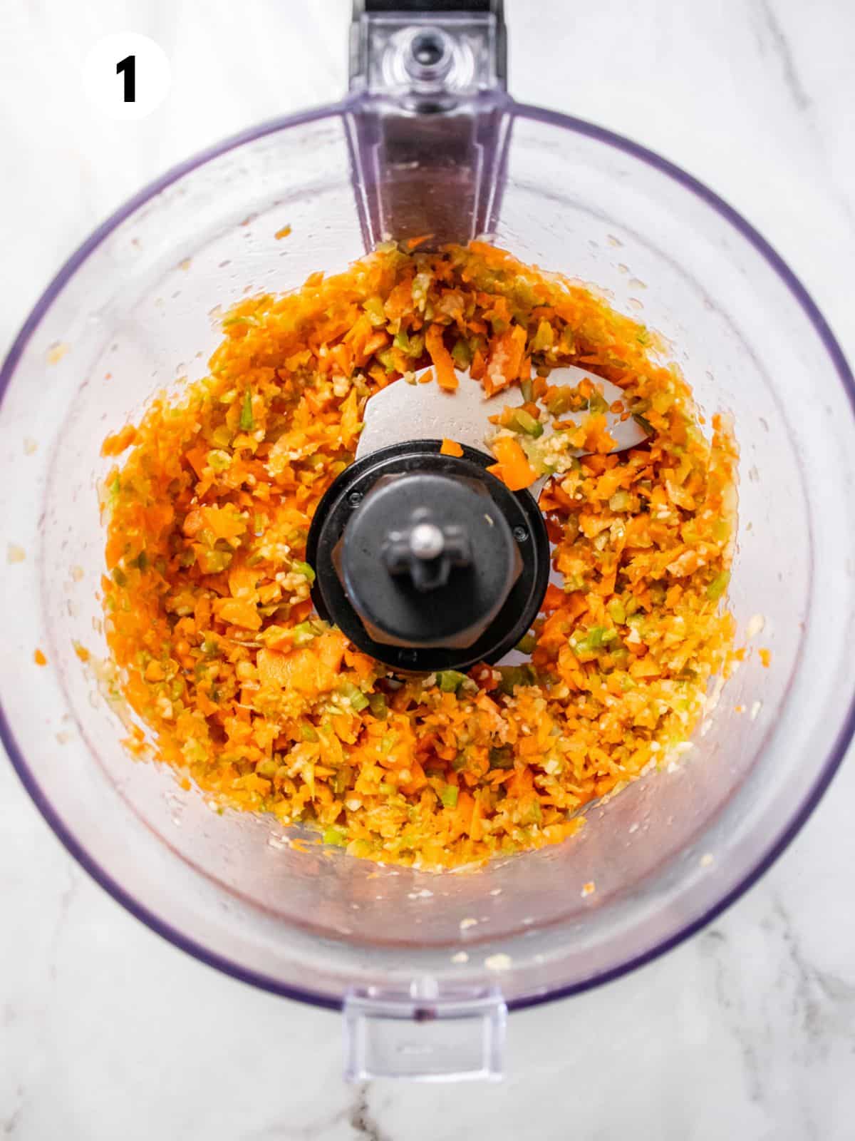 Vegetables chopped very small in a food processor bowl.