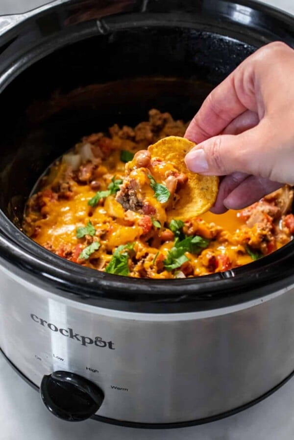 Healthy Crockpot Chili Cheese Dip is packed with protein and fiber to make a lower calorie appetizer.