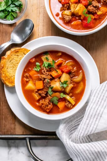 Healthy Beef Vegetable Soup is a simple low calorie homemade soup recipe. Easy to make on the stovetop, slow cooker or Instant Pot!