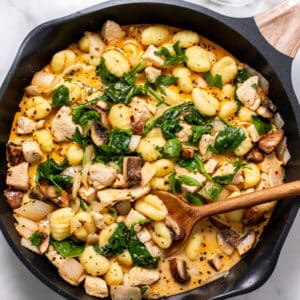 This Healthy Chicken Gnocchi Skillet is an easy meal that is low calorie. Made with simple ingredients, the chicken and gnocchi is cooked in a creamy sauce and packed with vegetables.