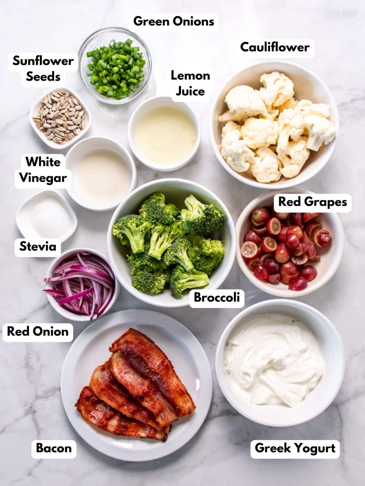 Ingredients to make a healthy broccoli salad with cauliflower on the table.