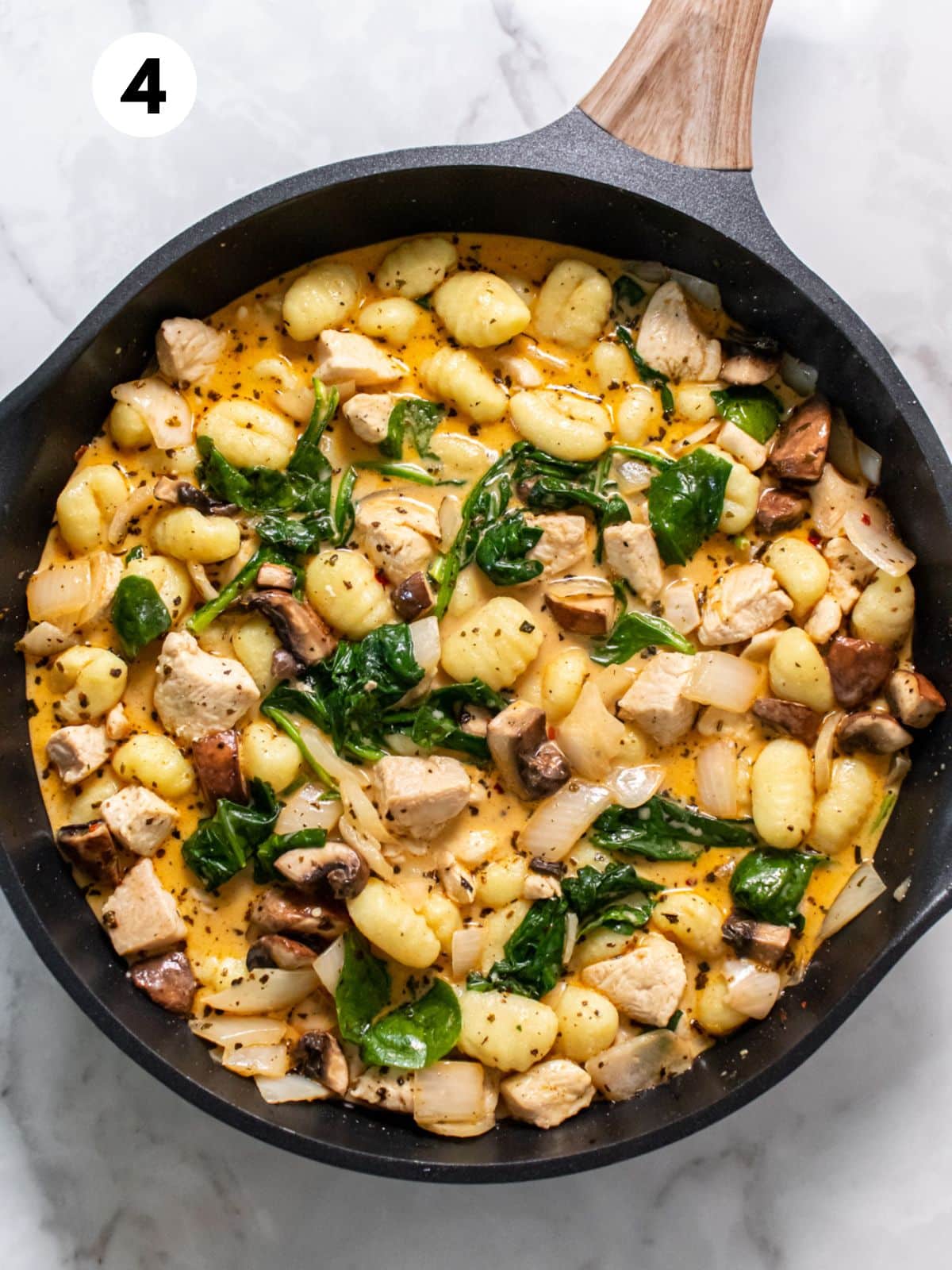 Gnocchi added to the skillet to finish the dish.