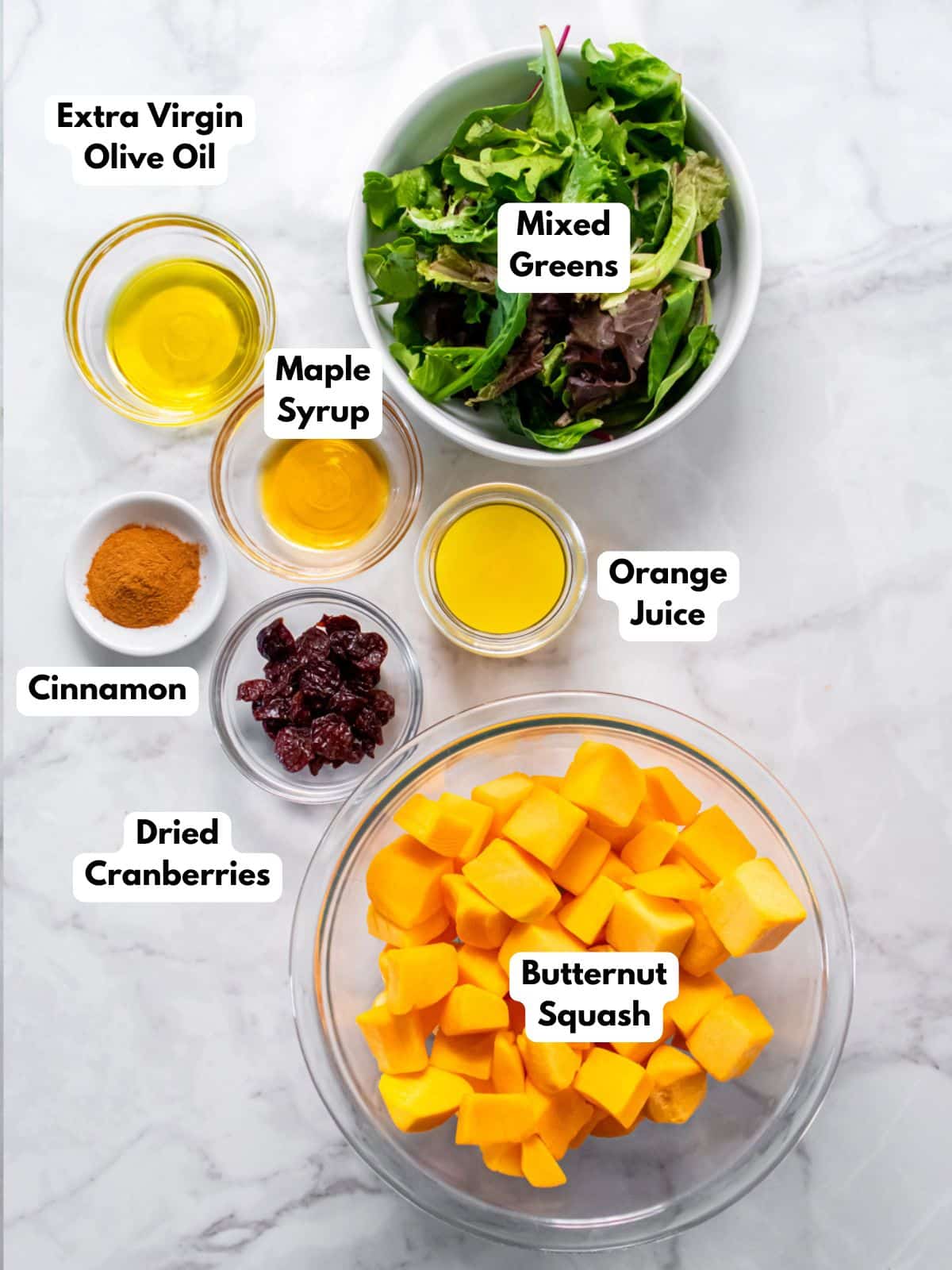 Ingredients to make butternut squash salad in bowls. 