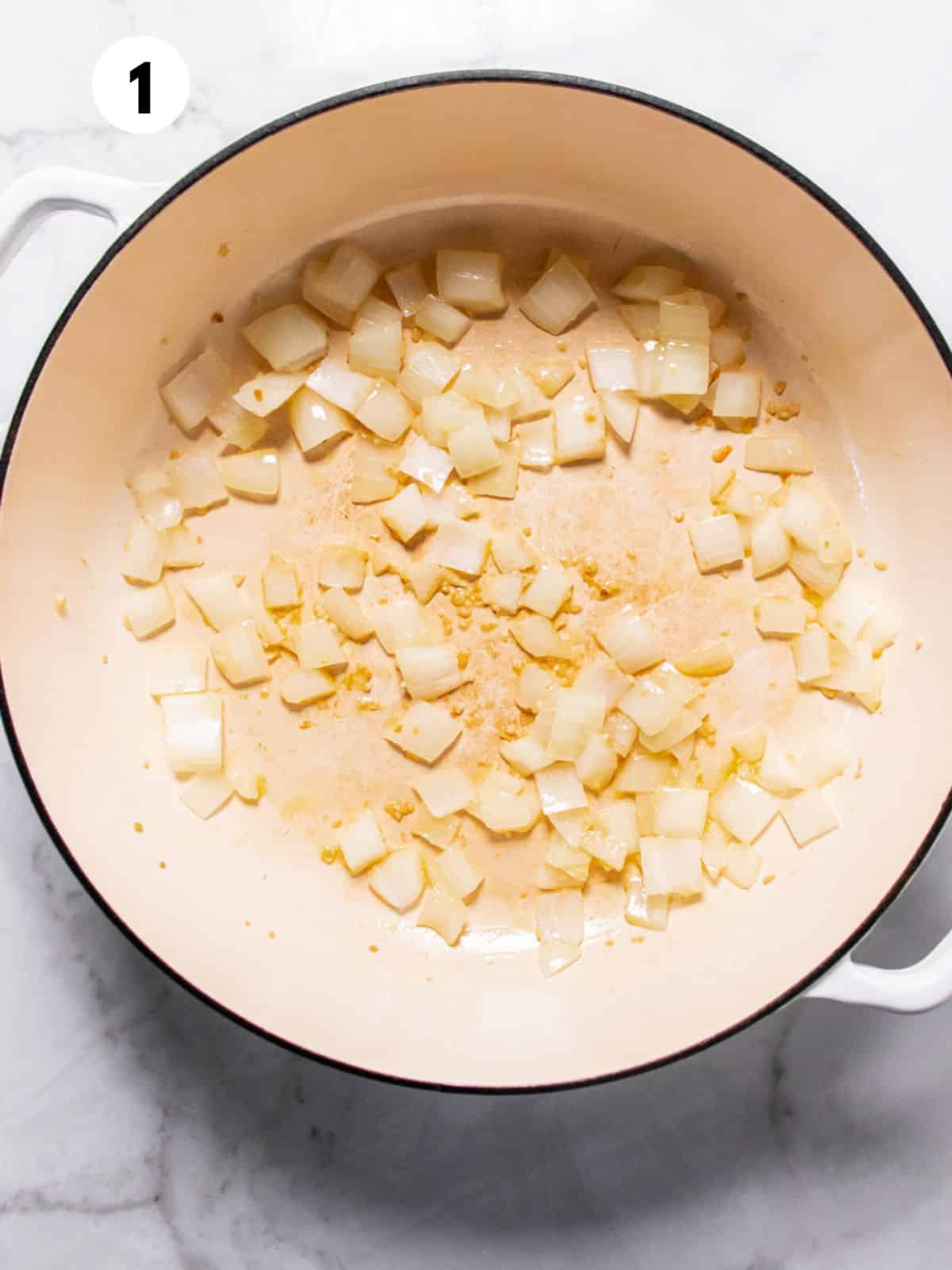 Onions cooking in a Dutch oven.