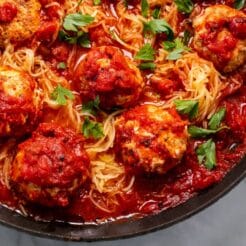 Turkey veggie meatballs in tomato sauce in a skillet.
