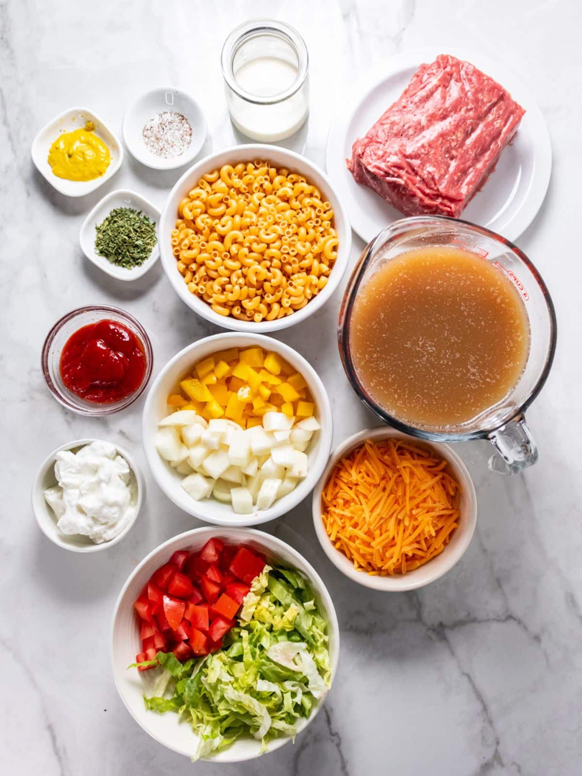 Ingredients for healthy cheeseburger macaroni on the table before cooking.