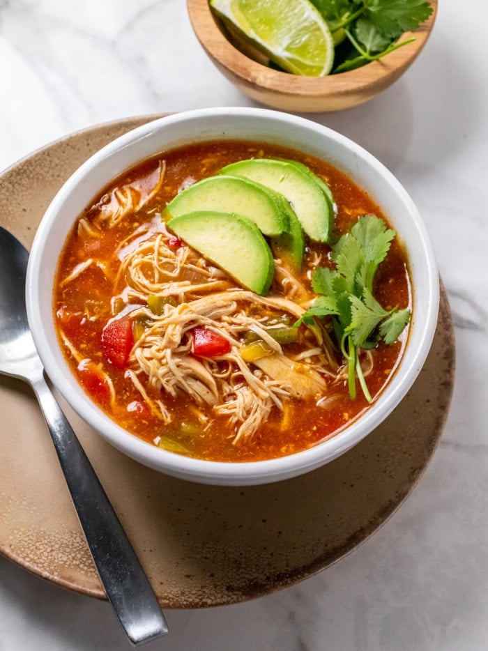 Healthy Enchilada Soup is low calorie, thick, creamy, loaded with delicious flavors and packed with protein. 