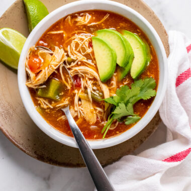 Healthy Enchilada Soup is low calorie, thick, creamy, loaded with delicious flavors and packed with protein.
