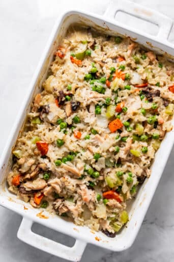 white casserole dish with chicken and vegetables