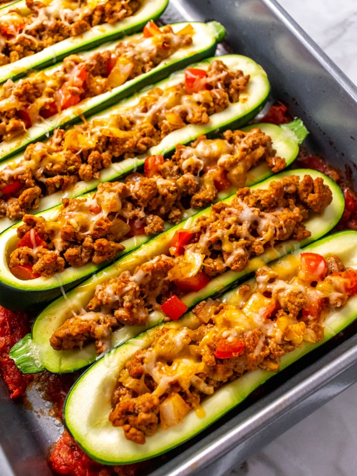 zucchini boats with ground meat on a sheet pan