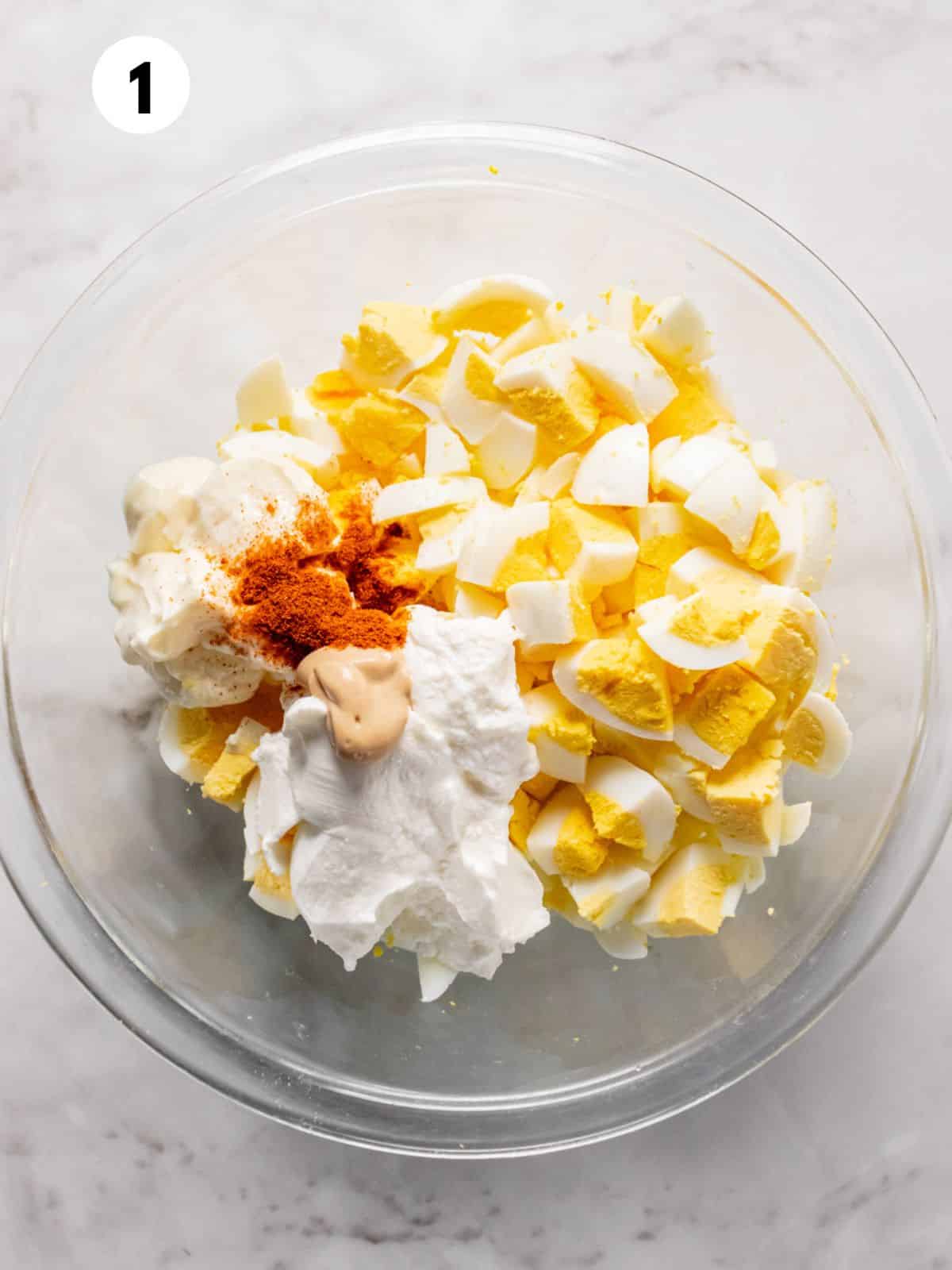 Ingredients to make healthy egg salad in a bowl.