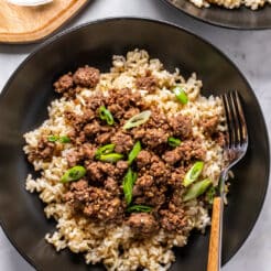 black bowl with brown rice and cooked ground beef