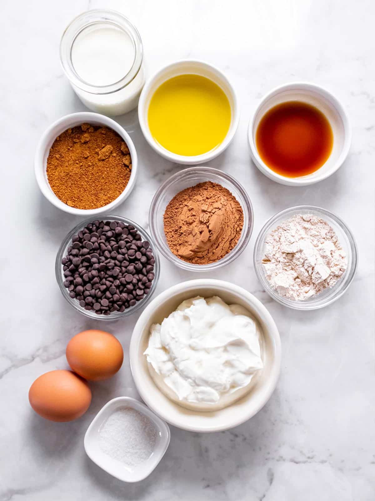 White bowls with ingredients to make healthy brownies.