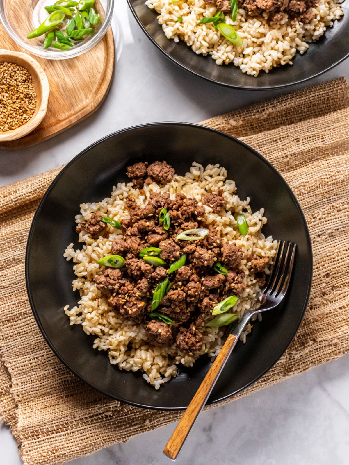 brown rice topped with ground beef in a bowl