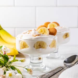 pudding in a clear glass with sliced bananas