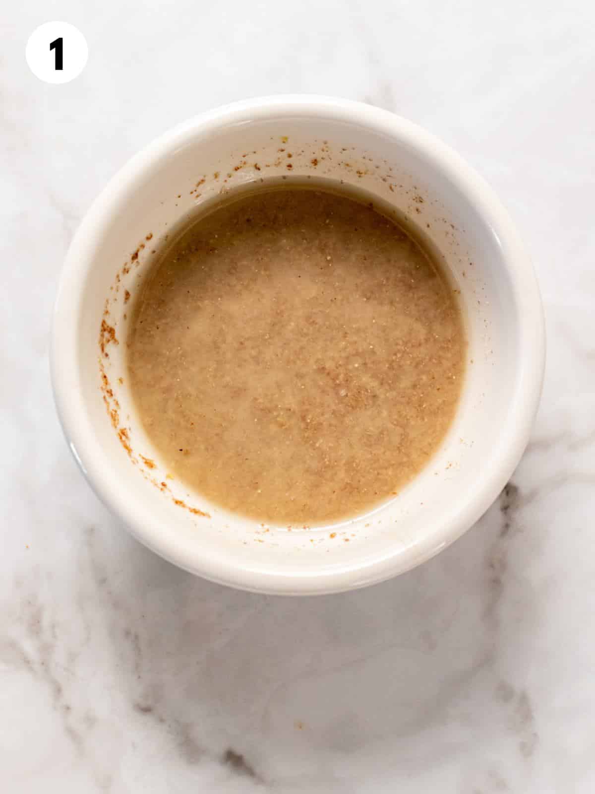 Water and flax mixed together in a small bowl.