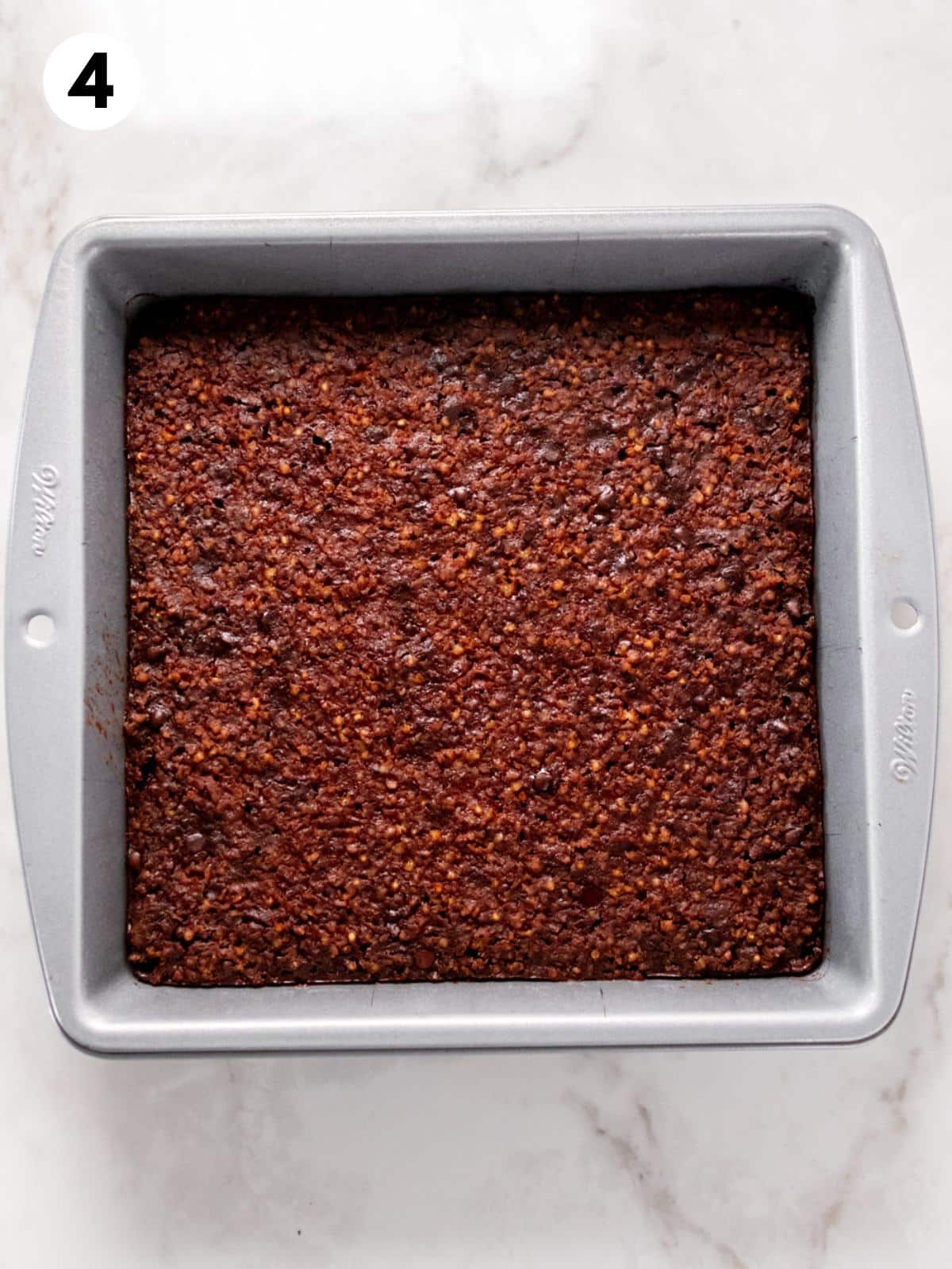 Quinoa brownies baked in a square pan.