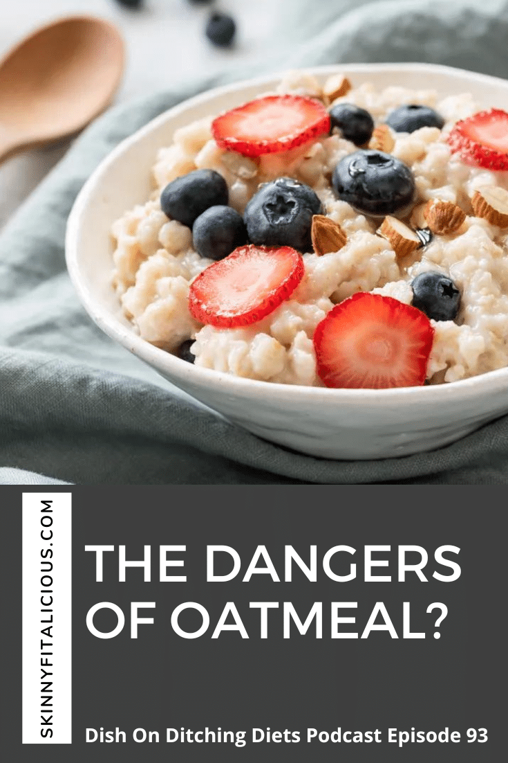 bowl of oatmeal topped with strawberries and blueberries