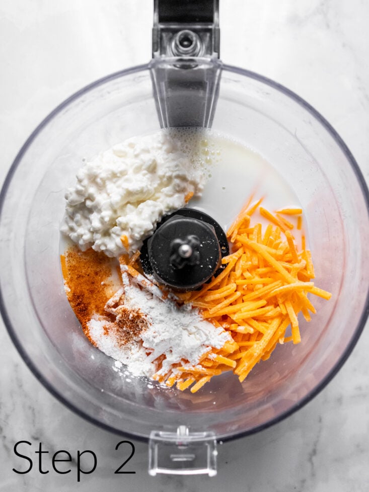 food processor with cottage cheese and shredded cheese