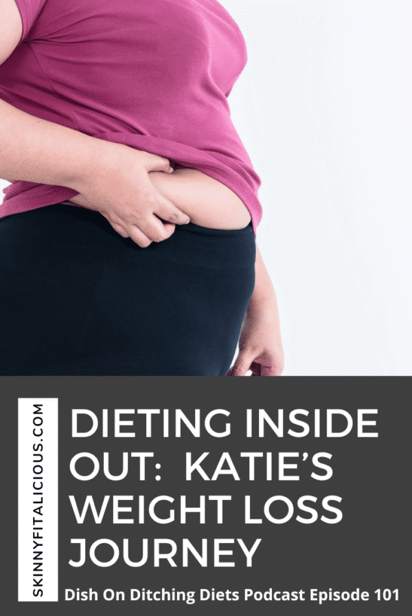 woman pinching her belly.