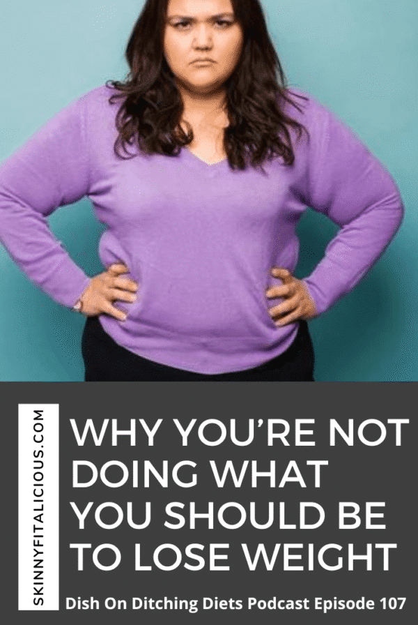 woman in purple shirt with hands on her hips.