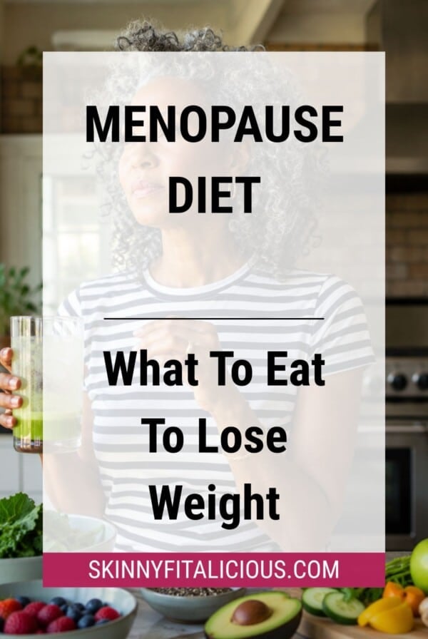Woman holding a green smoothie in a kitchen with fresh fruits and vegetables on the counter, representing a menopause diet.