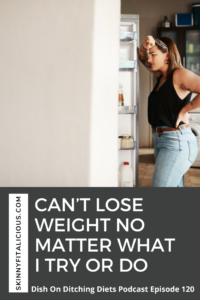 women dieting frustrated in front of a refrigerator in a black tank top.