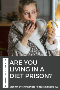 woman in a bathrobe eating a donut with a banana in her hand.