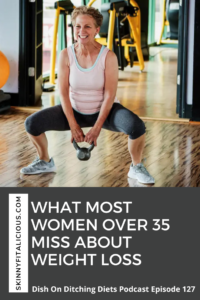 Older woman in a gym with a kettlebell doing a squat.