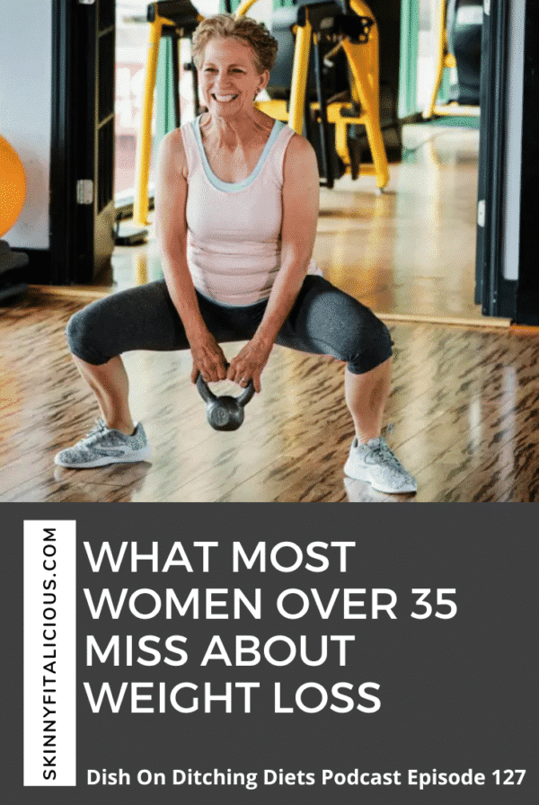 Older woman in a gym with a kettlebell doing a squat.