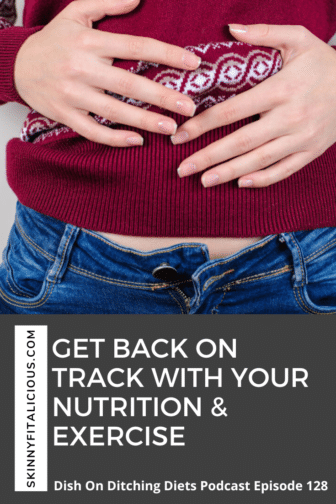 woman in a holiday sweater with her hands on her stomach from overeating.