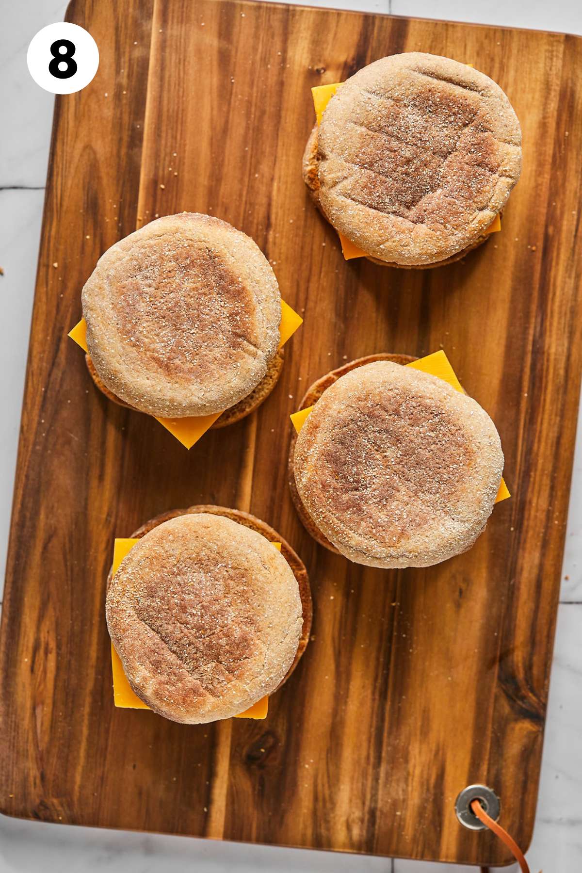 Tops are placed on to make the complete sandwiches.