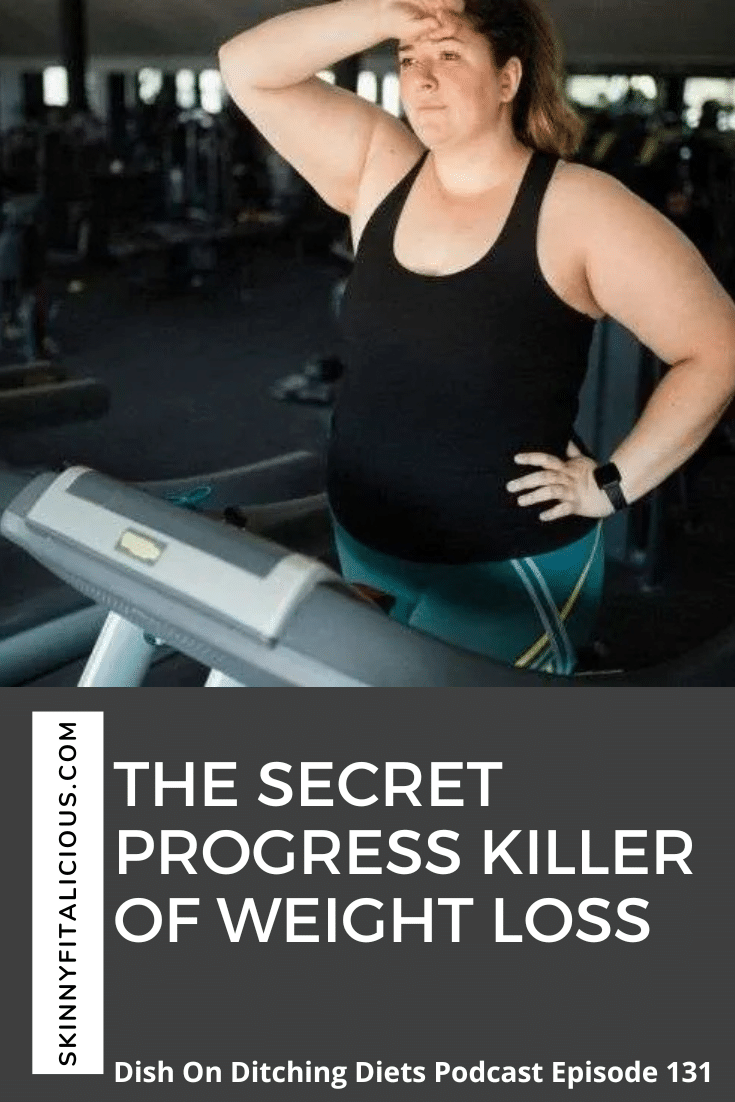 woman on a treadmill with black tank top and hand on her head.