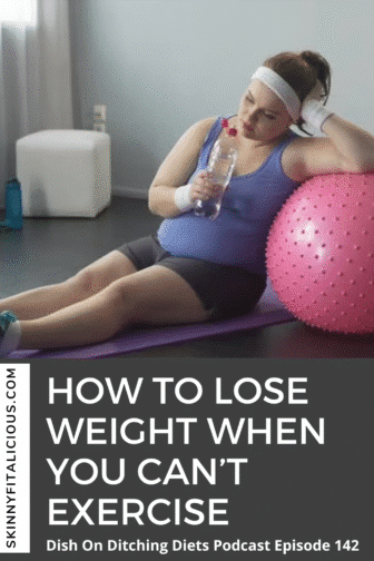 woman sitting on the floor in her exercise clothes leaning up against a pink exercise ball.