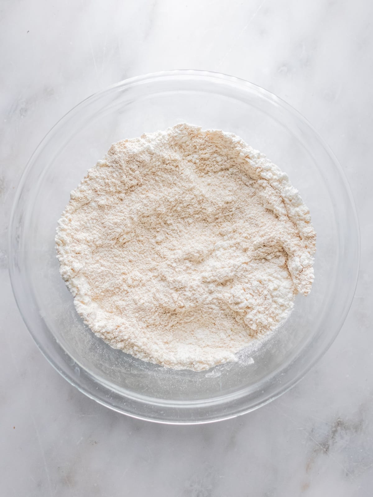 Dry ingredients added to a bowl.