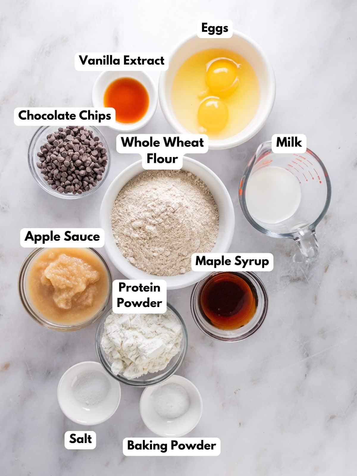 Ingredients to make these protein powder muffins in a bowls.