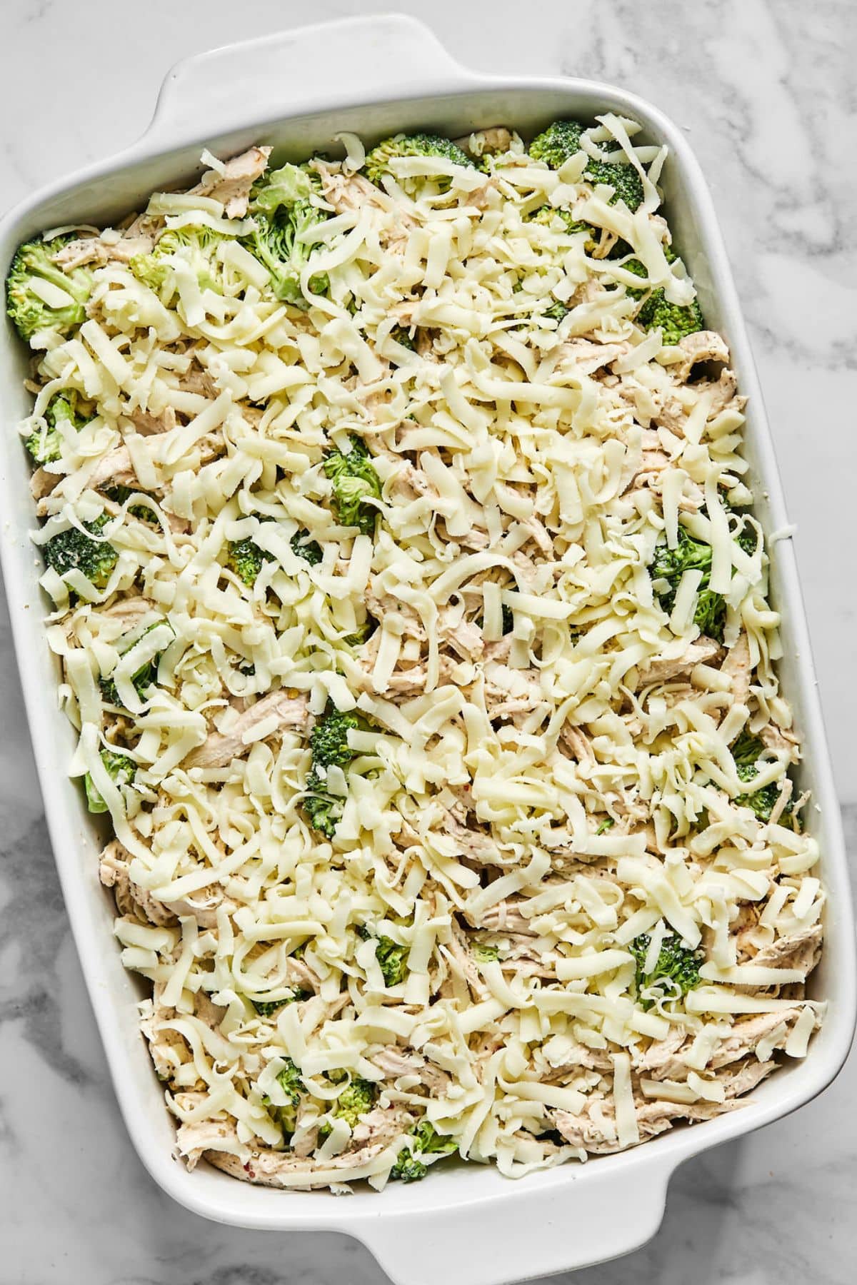 Cheese added to the top of the casserole.