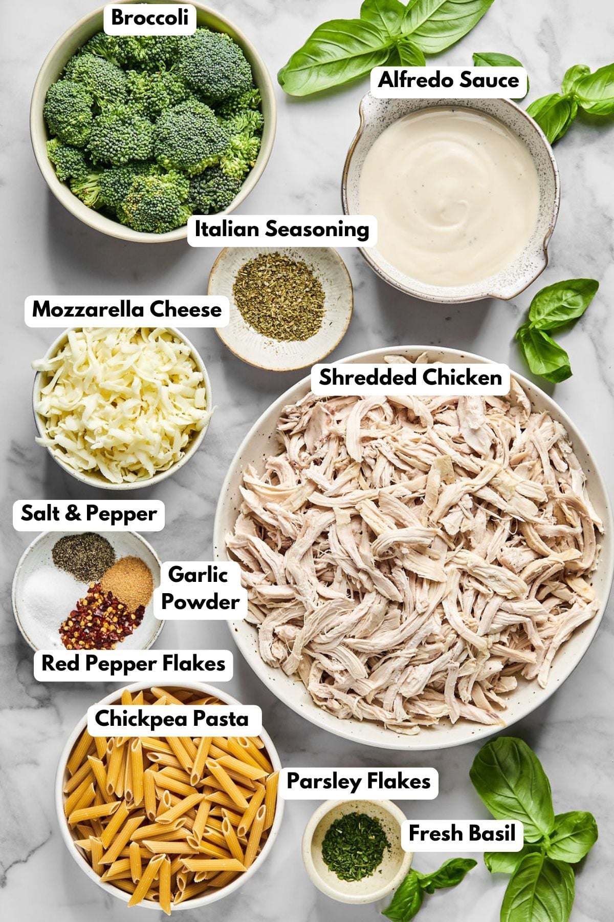 Ingredients to make this casserole in bowls on a table.