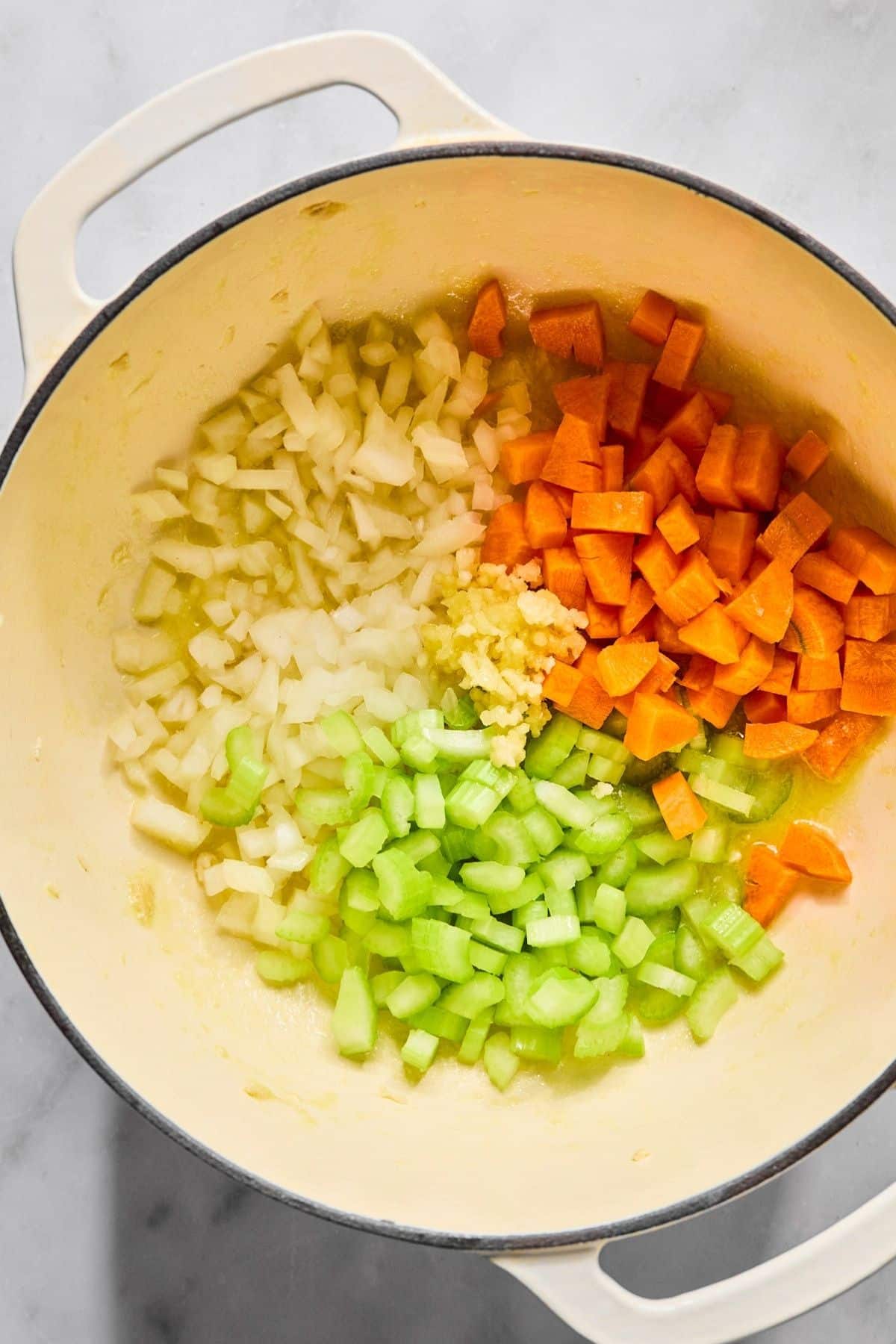 Vegetables added to the pot to cook.