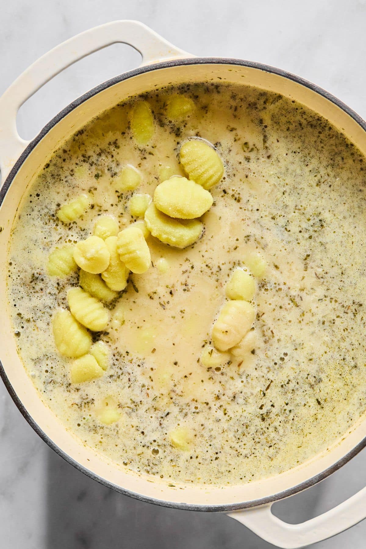 Gnocchi added to the pot of soup.