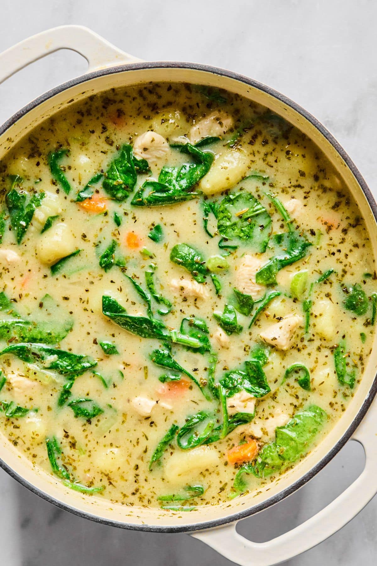 Pot of creamy gnocchi soup ready to serve.